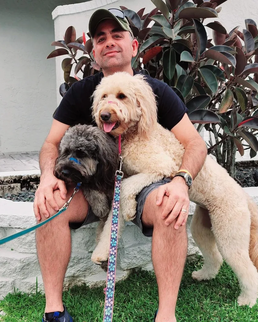 Todd Lesk with his two Goldendoodles